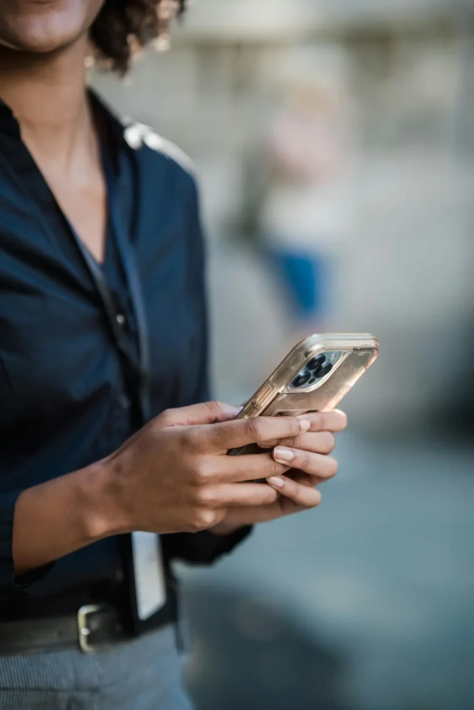 Closeup of practitioner on her phone by Marker Marketing