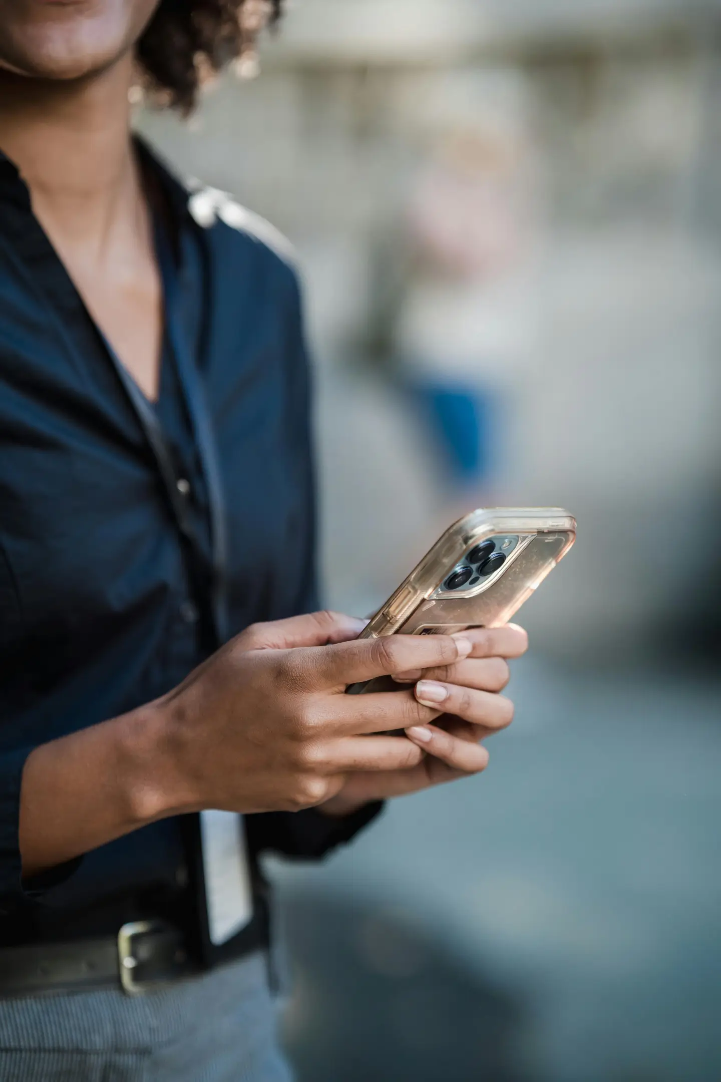 Closeup of practitioner on her phone by Marker Marketing
